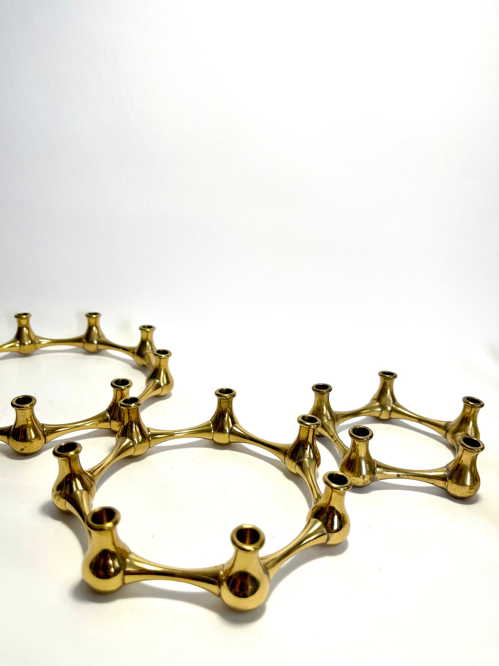Set of five brass taper candle holders designed by Jens Quistgaard for Dansk Designs, Denmark, c.1960s