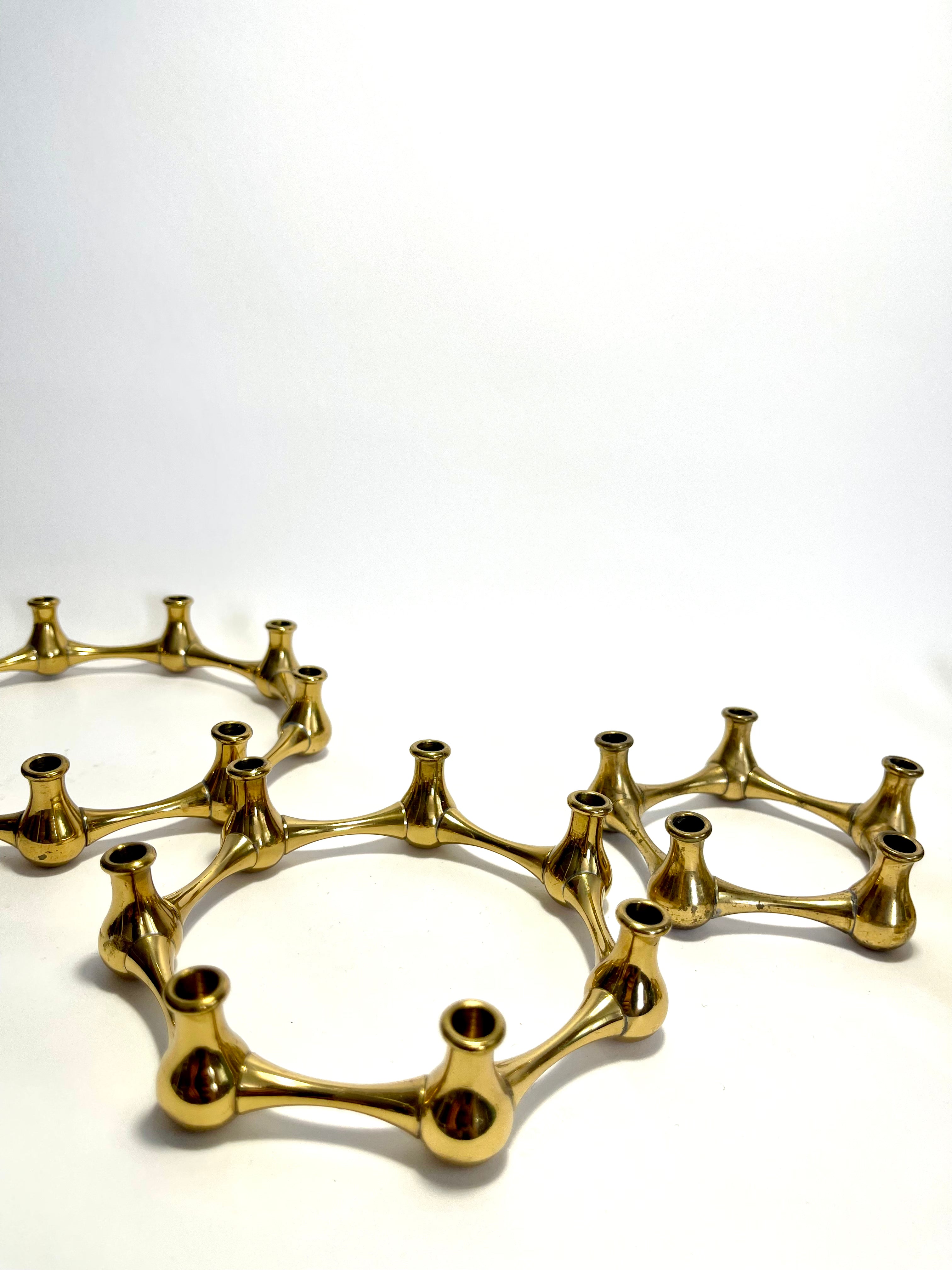 Set of five brass taper candle holders designed by Jens Quistgaard for Dansk Designs, Denmark, c.1960s