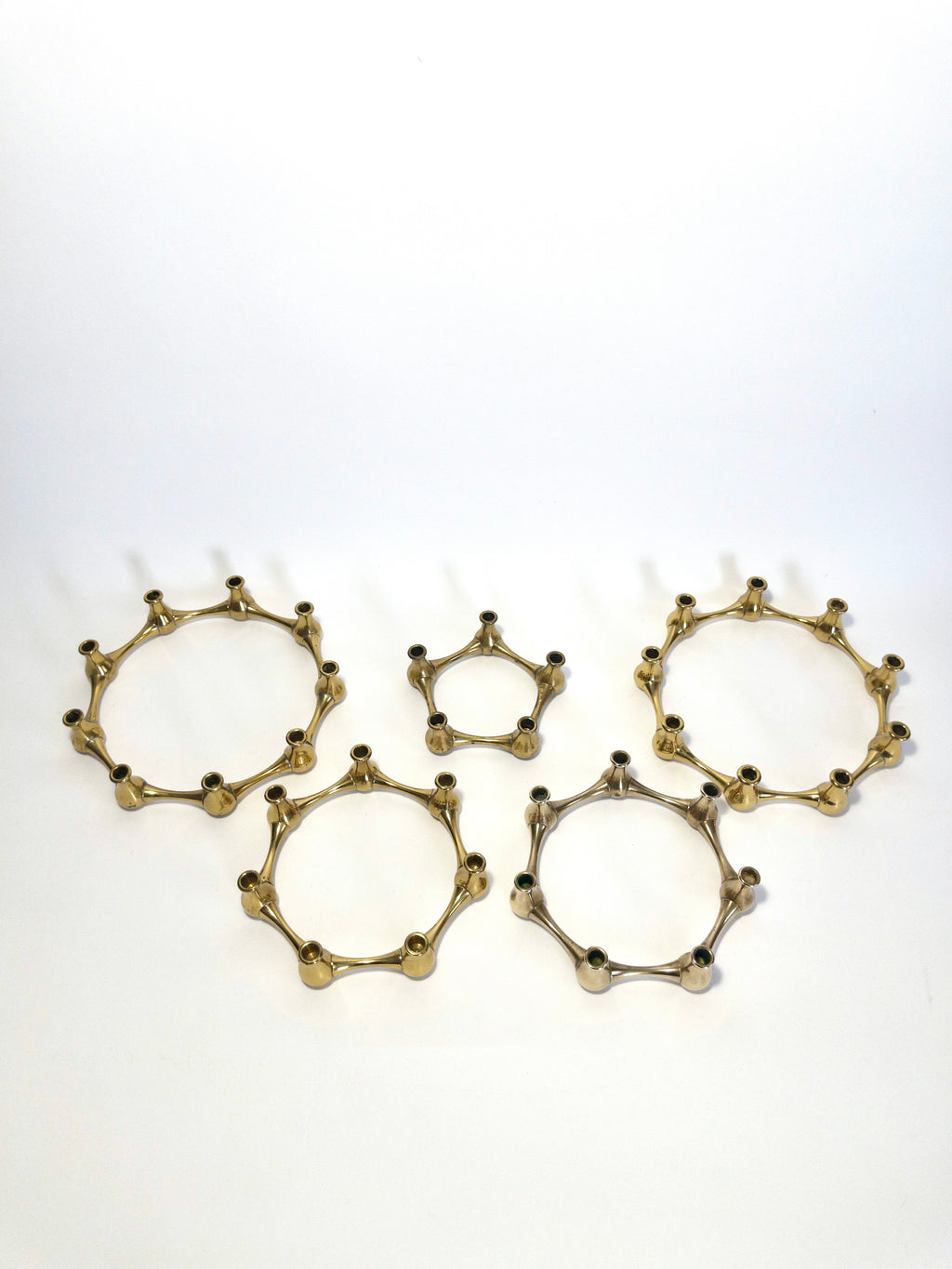 Set of five brass taper candle holders designed by Jens Quistgaard for Dansk Designs, Denmark, c.1960s
