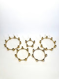Set of five brass taper candle holders designed by Jens Quistgaard for Dansk Designs, Denmark, c.1960s