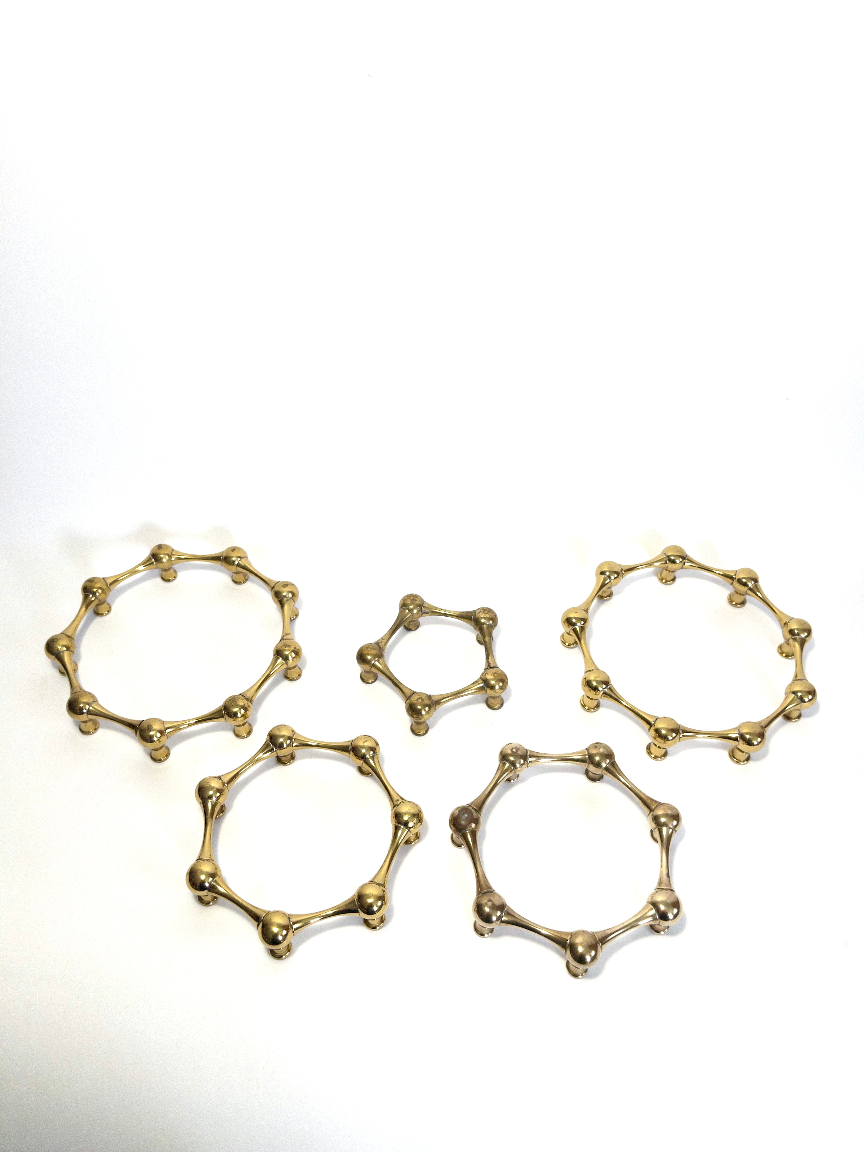 Set of five brass taper candle holders designed by Jens Quistgaard for Dansk Designs, Denmark, c.1960s